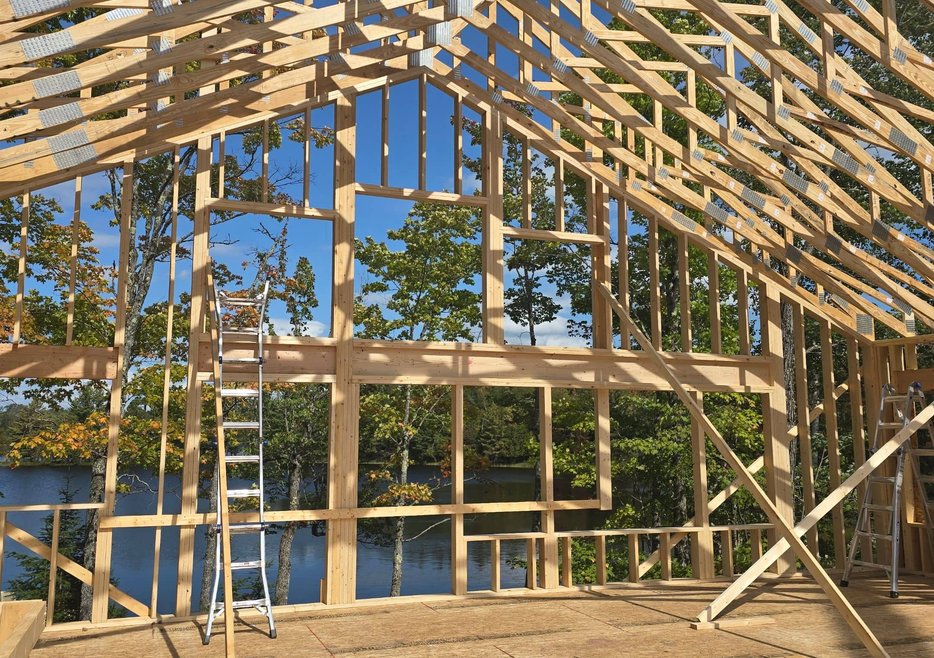 Framing crew installing beam, Wisconsin construction by JSA Solutions